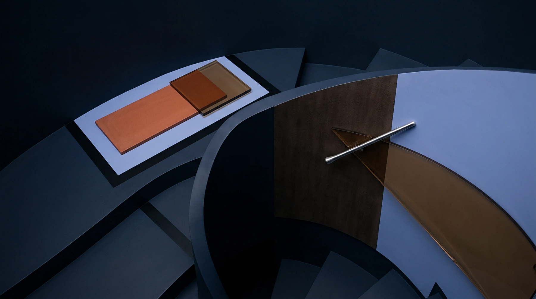 Polished color and material swatches rest beside a dark structural staircase inside a modern production development center.